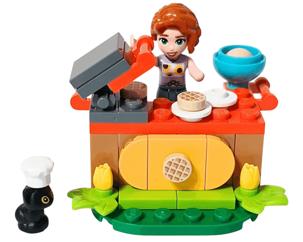 LEGO Friends 30696 オータムのワッフル屋さん 組立完成。屋台の後ろに立つオータムと、手前に立つコック帽の黒ネコ・プルートが並んでいる