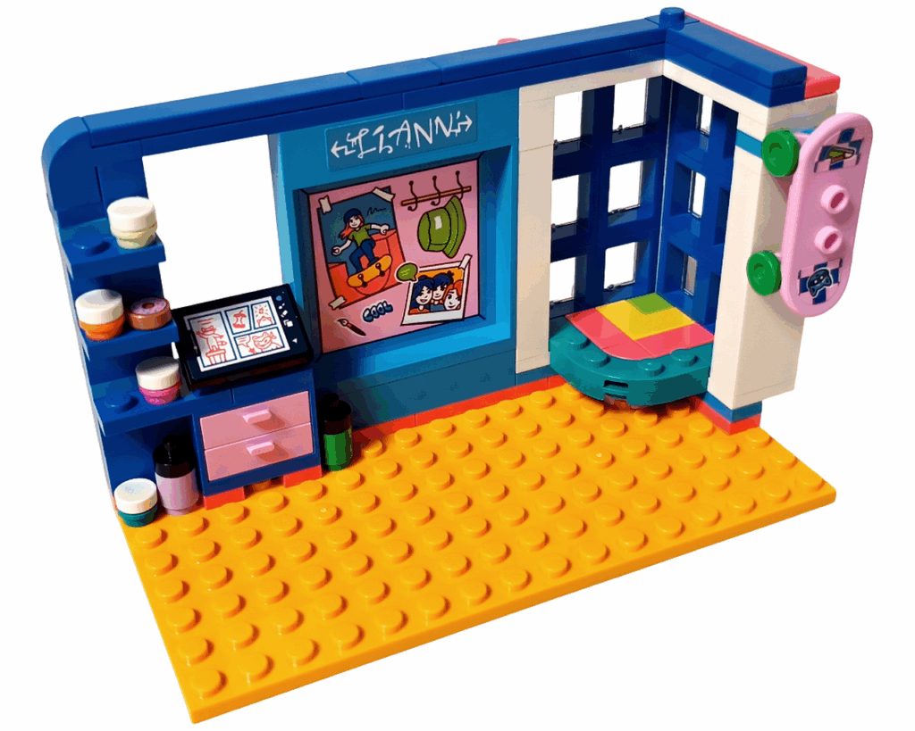 LEGO Friends 41739 リアンの部屋 スケートボードの取りつけ。 右側の白い壁にピンクのスケートボードが飾られ、下にはカラフルなコーナーテーブル、左にはイラストデスクが見える。