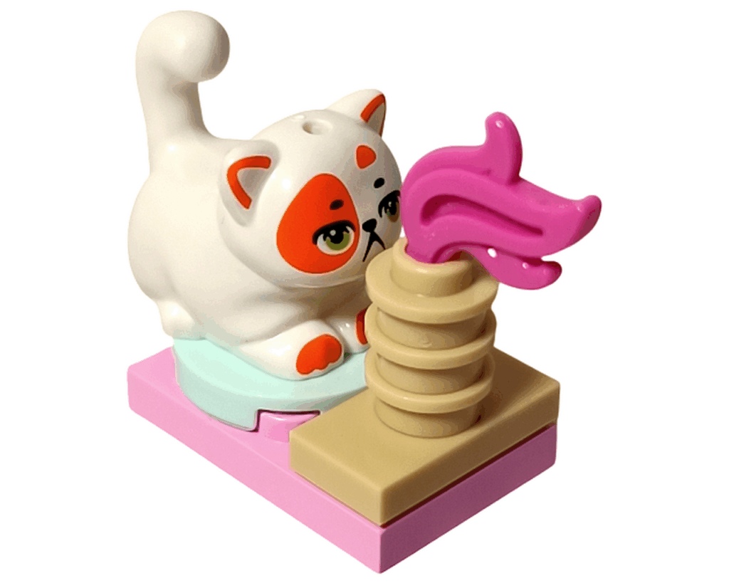 LEGO Friends 42668 ネコのチュロスと爪とぎポスト。白いネコがベージュのポールに向かって伸びをしている。ピンクの羽の飾りがついている。