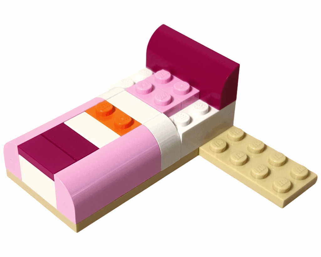 ライトピンクとマゼンタのブロックで枕と布団が表現されたベッド