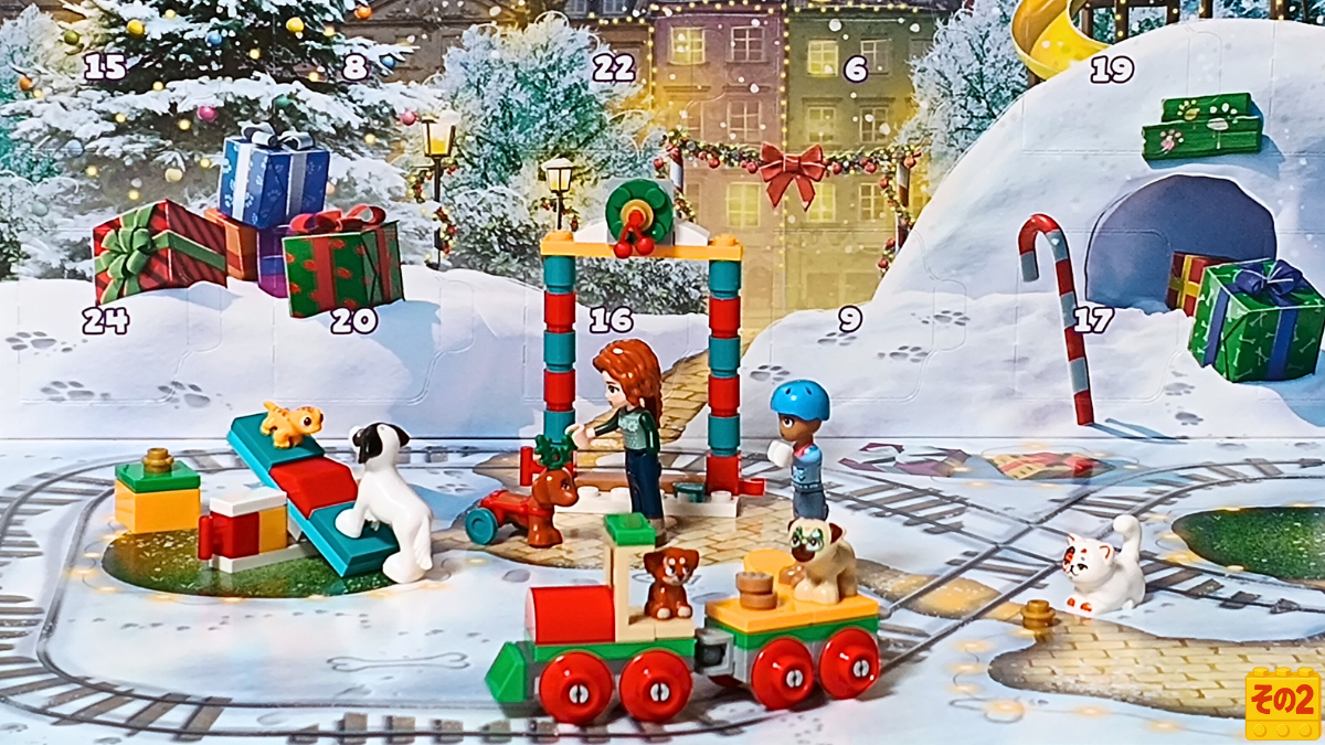 雪の広場でオータムとペットたちが遊び、トレインやアジリティなどのミニモデルが並ぶ冬のシーン。