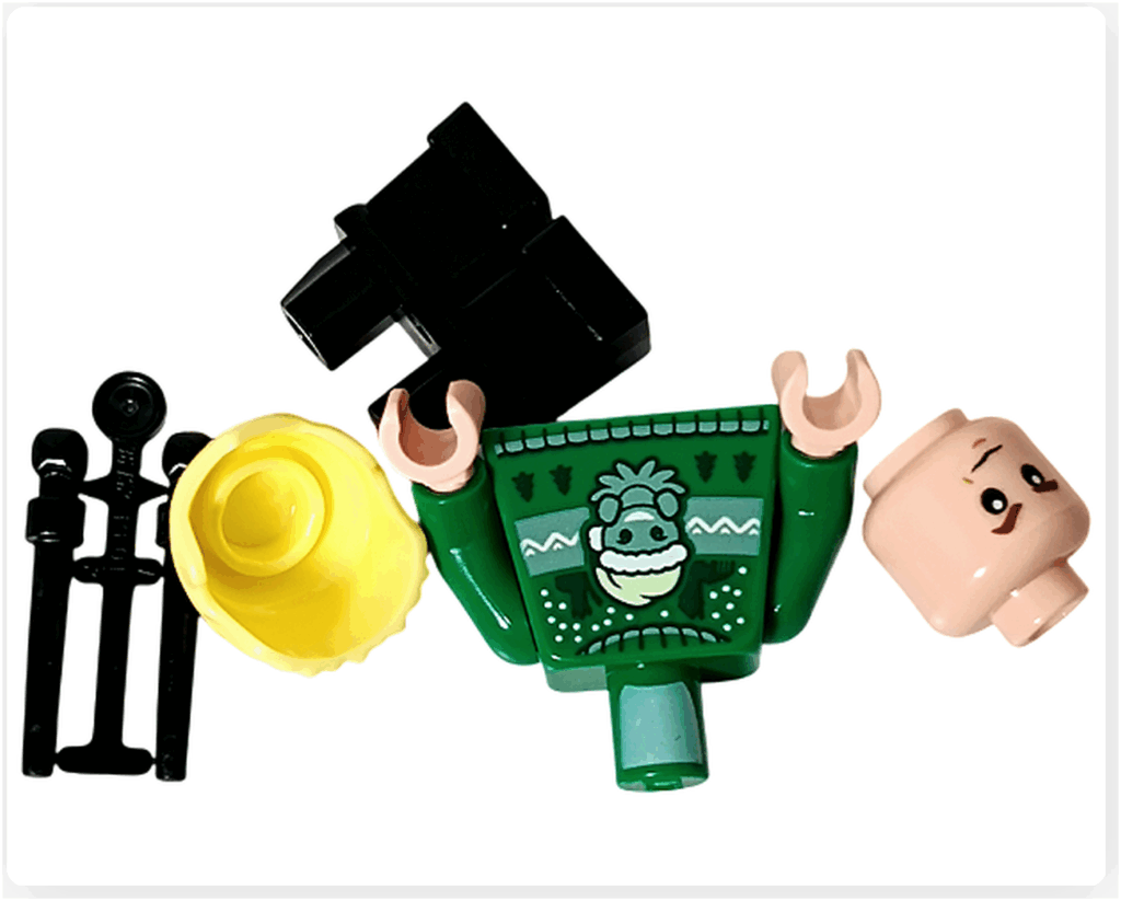 LEGO Harry Potter 76456「ハリー・ポッター アドベントカレンダー2025」7日目のパーツ。 ドラコ・マルフォイのミニフィギュア用で、金髪パーツ、表情パーツ、グリーンのセーター胴体、黒い脚部、黒い杖が含まれている。