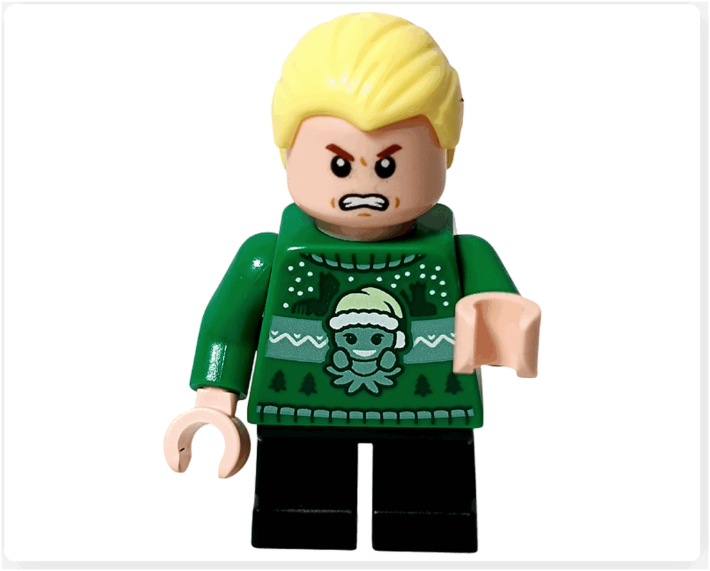 LEGO Harry Potter 76456「ハリー・ポッター アドベントカレンダー2025」ドラコ・マルフォイの怒り顔。 眉を吊り上げ、口を開けて怒った表情。緑のセーター姿で、黒い杖を手にしている。