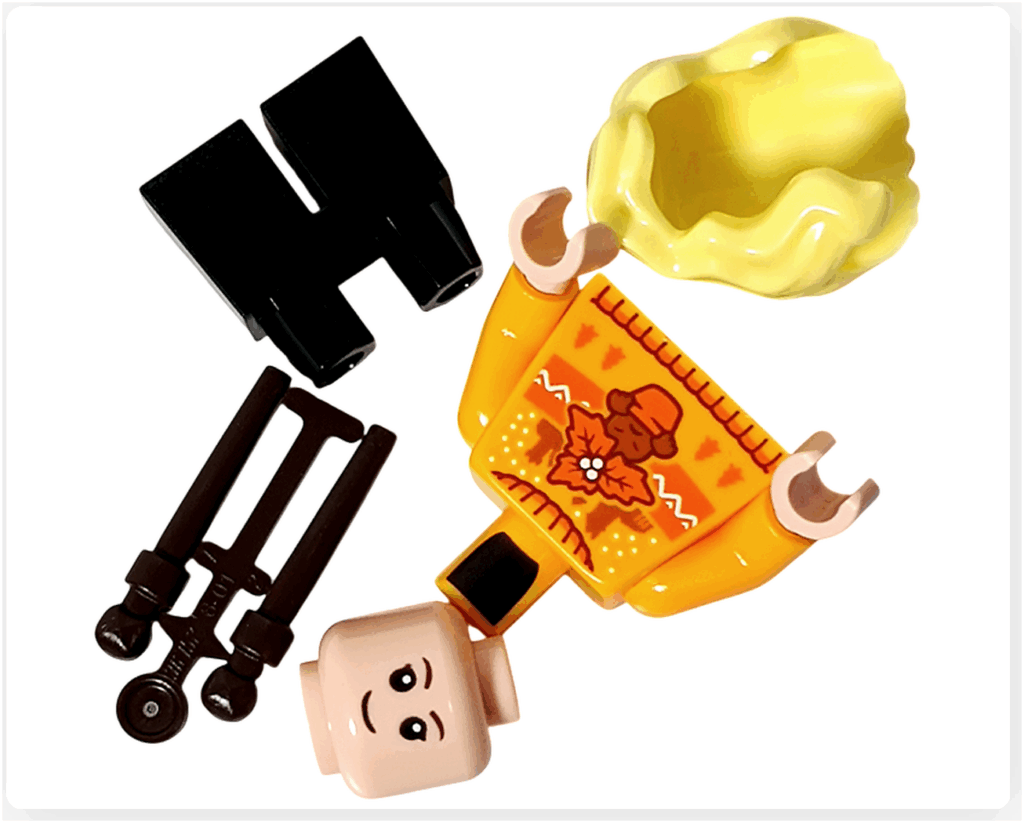 LEGO Harry Potter 76456「ハリー・ポッター アドベントカレンダー2025」10日目のパーツ。 黄色の髪パーツ、オレンジイエローのセーターにマンドレイクのプリント、黒の脚部、杖2本が並ぶ。 薬草学が得意なハッフルパフ生、ハンナ・アボットを再現した構成。