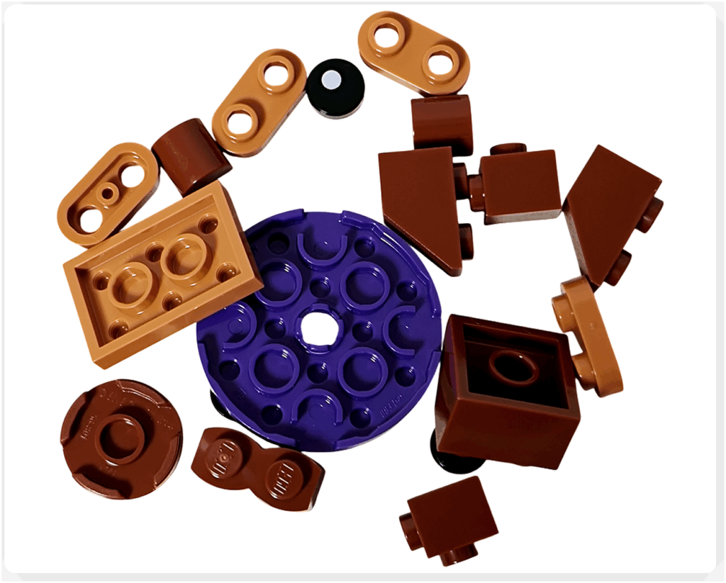 LEGO Harry Potter 76456「ハリー・ポッター アドベントカレンダー2025」11日目のパーツ。 茶色系のブロックと紫の円形プレートを中心に構成されており、「チョコレート・フロッグ」を組み立てるための部品。