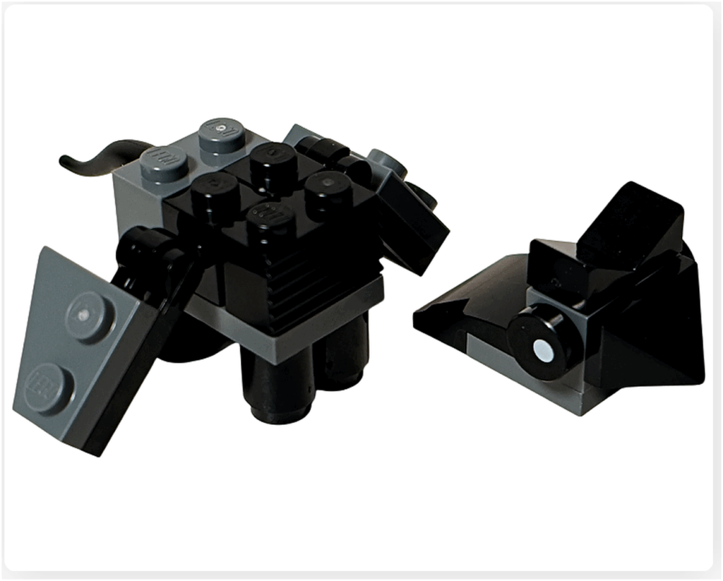 LEGO Harry Potter 76456 アドベントカレンダー2025のサストラル組立途中。 黒とグレーのブロックで胴体と翼が形成され、頭部パーツが横に置かれている。