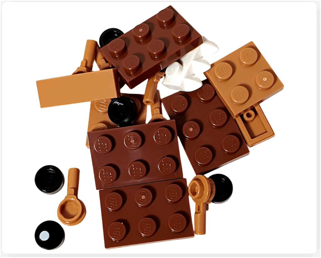 LEGO Harry Potter 76456 アドベントカレンダー2025の20日目パーツ。 ブラウンとダークタンを中心に、黒のラウンドプレートや白い歯型パーツを含む構成。 「The Monster Book of Monsters（怪物的な怪物の本）」を組み立てるためのブロック一式。