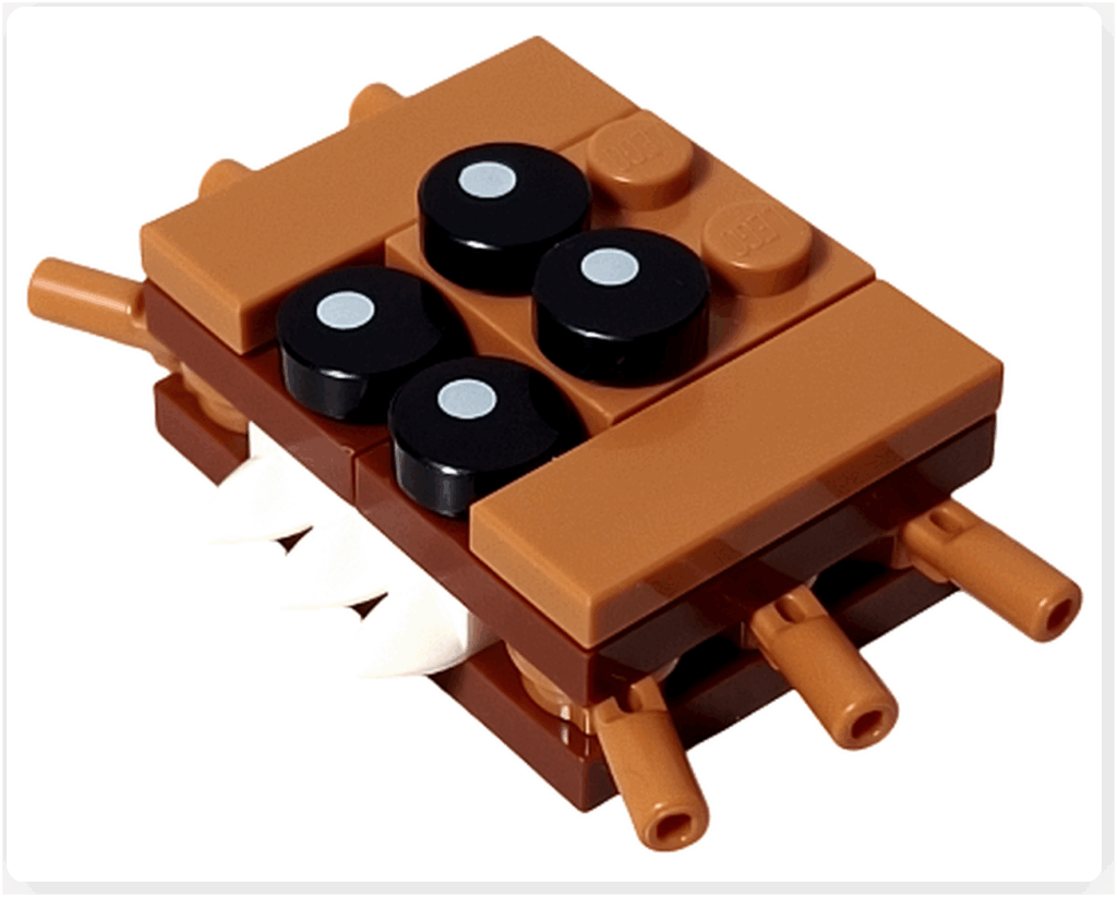 LEGO Harry Potter 76456「ハリー・ポッター アドベントカレンダー2025」20日目の完成モデル。 茶色のブロックで作られた本型モデルに白い歯形パーツと黒い丸い目パーツが取りつけられている。 「The Monster Book of Monsters」をモチーフにしたミニビルド。