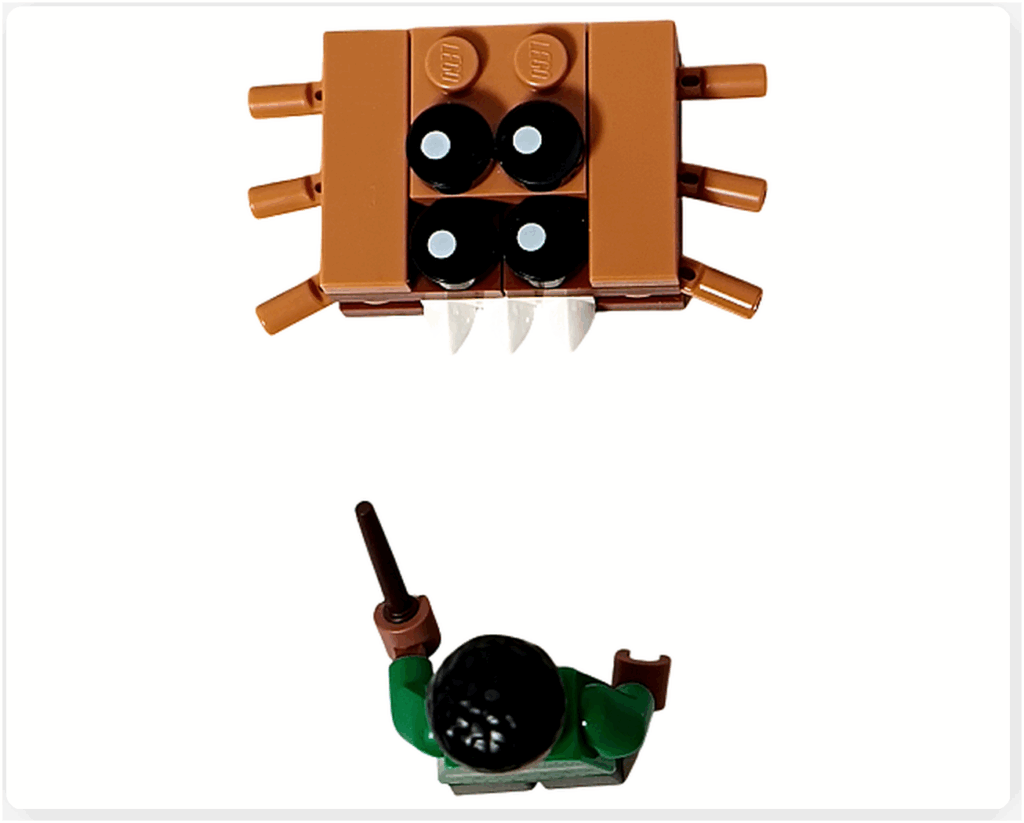 LEGO Harry Potter 76456「ハリー・ポッター アドベントカレンダー2025」 ブレーズ・ザビニのミニフィギュアが「怪物的な怪物の本」のミニモデルを前に立っているシーン。 スリザリンの書庫を思わせる暗めの背景で、杖を構えながら本を見つめている構図。