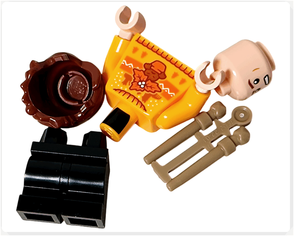 LEGO Harry Potter 76456「ハリー・ポッター アドベントカレンダー2025」22日目のパーツ。 オレンジのセーターを着たセドリック・ディゴリーのミニフィギュア用パーツ。 顔、髪、胴体、脚、杖の各パーツが並べられている。