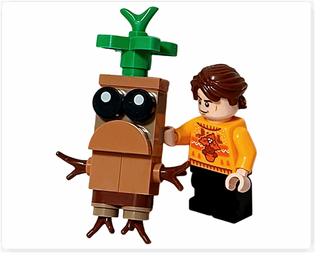 LEGO Harry Potter 76456 アドベントカレンダー2025より、セドリック・ディゴリーとマンドレイクのシーン。 黄色のセーターを着たセドリックが杖を持ち、温室の中でマンドレイクを見守っている様子。