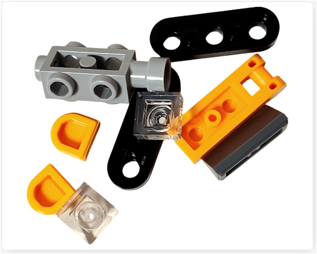 LEGO CITY 60475 Advent Calendar 2025（2日目）ミニ・ブルドーザーのパーツ構成。黄色ボディ、黒い履帯、クリアキャビンパーツが含まれる。