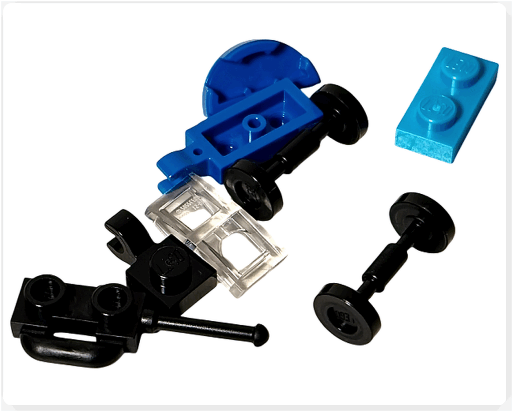 LEGO CITY 60475 Advent Calendar 2025（10日目）ラジコンカーのパーツ一式を上から見た写真。青い車体、クリアパーツ、タイヤ、送信機パーツなどが並んでいる。