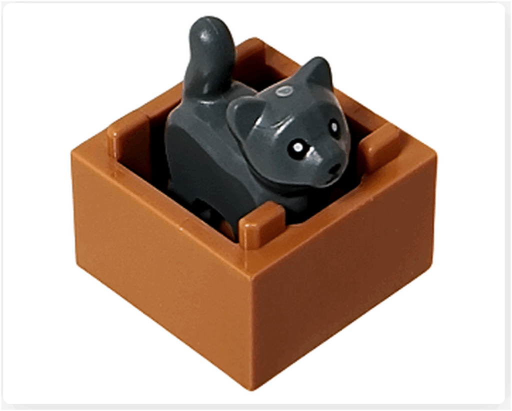 LEGO CITY 60475 Advent Calendar 2025（11日目）箱の中に子猫フィギュアをセットした完成状態を上から見た写真。小さな子猫が顔を出している。