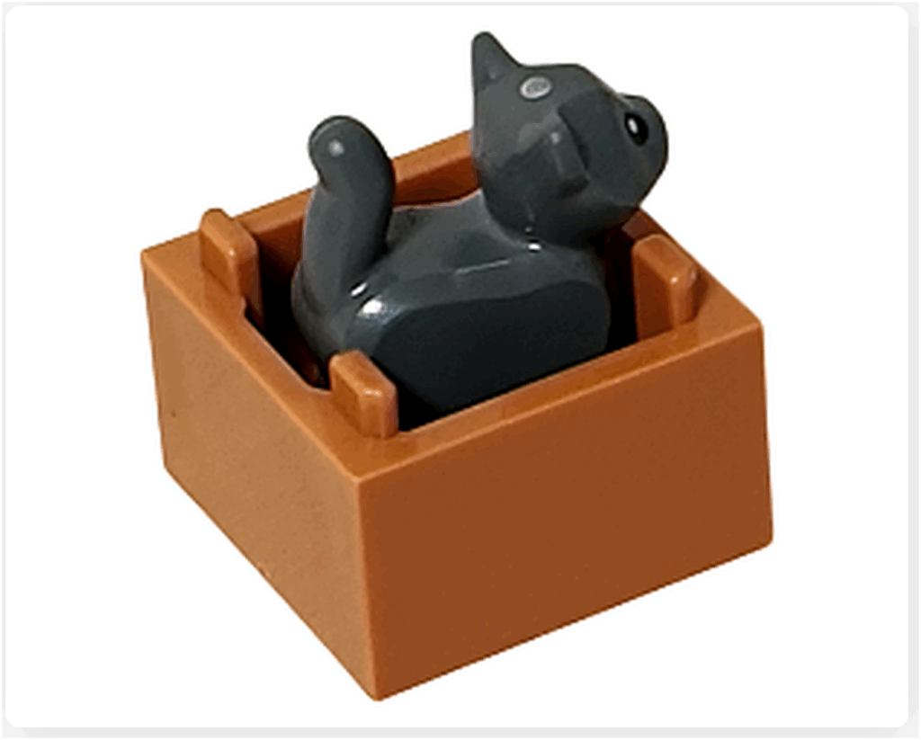 LEGO CITY 60475 Advent Calendar 2025（11日目）箱に入った子猫の背面写真。上向きのしっぽとブラウンの箱の後ろ側が見える構図。