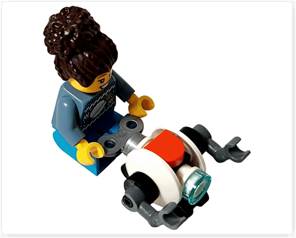 LEGO CITY 60475 Advent Calendar 2025（16日目）女性が小型ロボットのゼンマイを巻いているシーンの視点