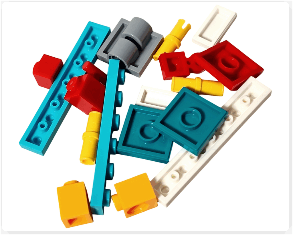 LEGO Friends 41758「アドベントカレンダー2023」10日目のパーツ。白いプレート、ターコイズのバー、赤と黄の小パーツ、中央支点となるグレーのヒンジが含まれています。