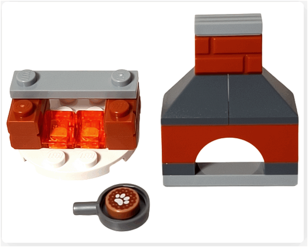 LEGO Friends 41758「アドベントカレンダー2023」15日目の組立途中。白い丸プレートに炎を表すオレンジクリアパーツが組まれ、レンガ色とグレーのブロックで窯本体の形が見えてきた段階です。手前には焼き菓子プリントの小パーツも配置。