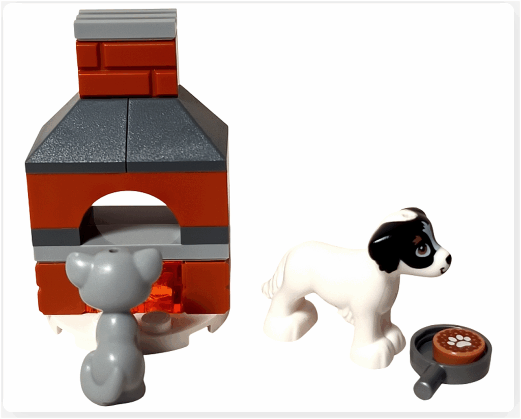 LEGO Friends 41758「アドベントカレンダー2023」15日目のシーン。窯の前に座る灰色の猫ガートルードと、横で焼き菓子入りのフライパンを見つめる白い犬デイジーの冬らしい情景です。