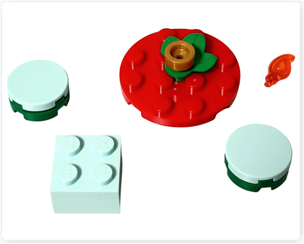 LEGO Friends 41758「アドベントカレンダー2023」16日目の組立途中。赤い丸テーブルに飾りパーツを取り付け、ミントグリーンの小テーブルを配置していく段階の様子です。