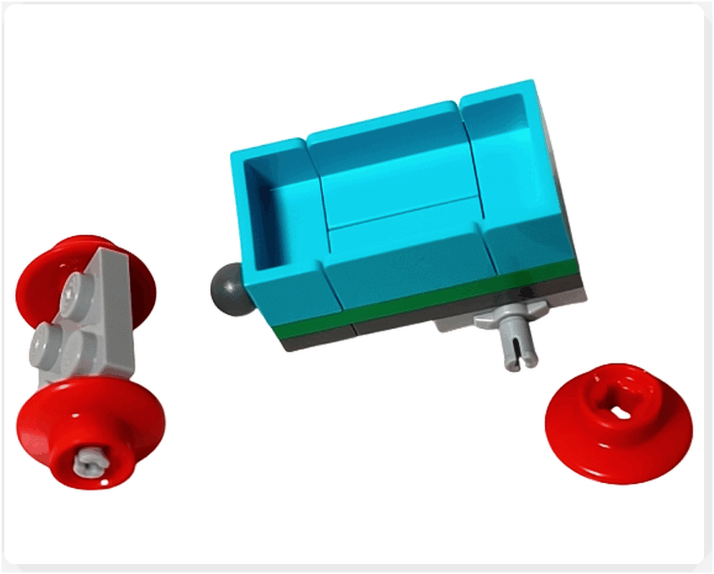 LEGO Friends アドベントカレンダー2023 23日目の組立途中。水色のパーツで荷台が形づくられ、赤い車輪パーツはまだ接続前の状態。