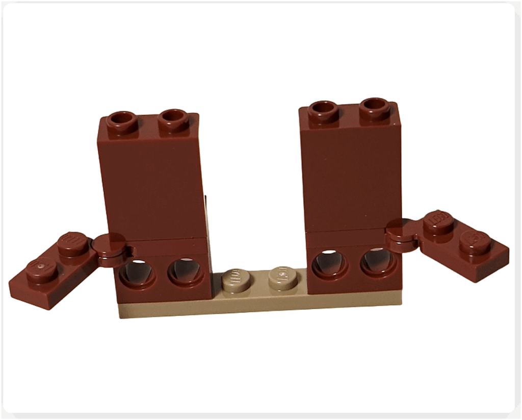 レゴ ハリー・ポッター 76442 呪文学の教室の奥の壁を組み立てている途中の工程。ブラウンのブロックが縦に積まれ、後に窓枠やアーチを取り付けるための基礎部分が作られている様子