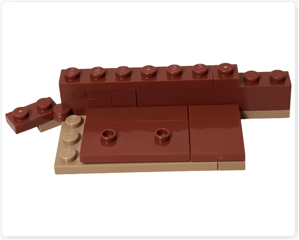 レゴ ハリー・ポッター 76442 左側の壁の土台を組み始めた工程。ブラウンとタンのプレートが並び、床の基礎ができている様子