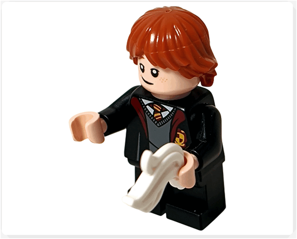 レゴ ハリー・ポッター 76442 のロン・ウィーズリーのミニフィグが、白い羽根パーツを両手で持っている様子。呪文学の授業シーンを再現したポーズ。