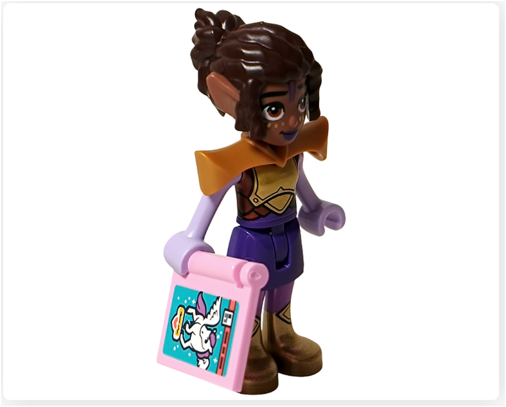 レゴ フレンズ 42674 アリヤのミニドール正面。中世の騎士風の衣装を着て、ユニコーンが描かれたコミックを手にしている。