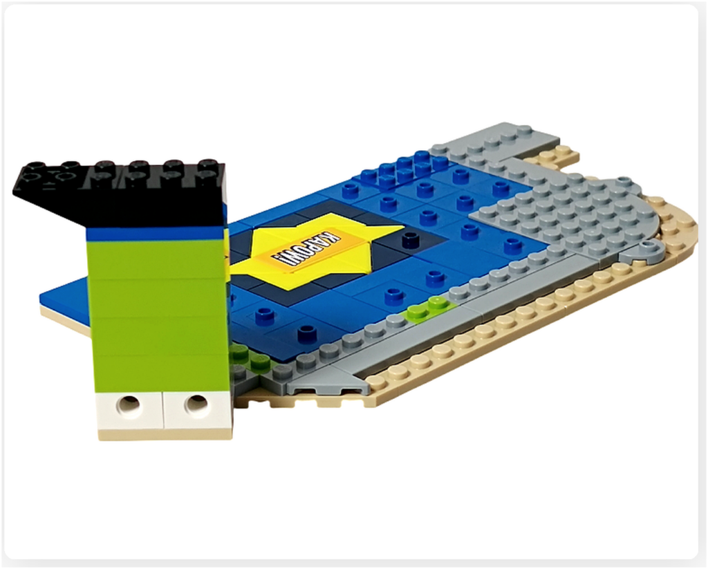 レゴ フレンズ 42674 組立レビュー第2部の1階コミックショップ壁写真。床パーツの端に壁となるブロックを配置し、壁の立ち上げを始めた状態。