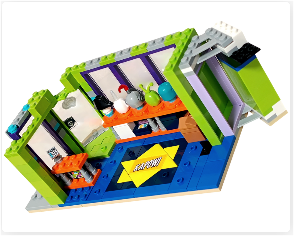 レゴ フレンズ 42674 組立レビュー第2部の写真。1階ゲームセンター内にレジカウンターを配置した状態。レジ端末とカウンターが床面に設置されている。