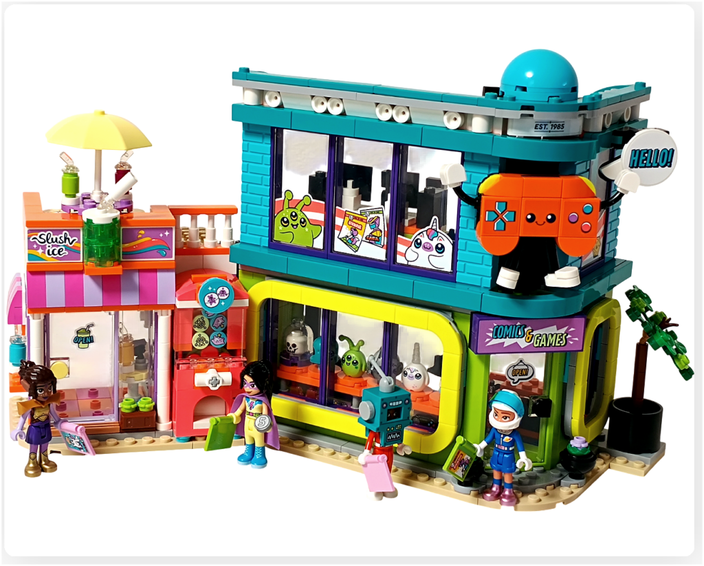 LEGO フレンズ 42674 フローズンドリンクのお店とコミック＆ゲームショップが並ぶ街角の完成全景。2階にはゲームセンターとコントローラー型マスコット、通りにはキャラクターたちが思い思いに過ごしている様子。