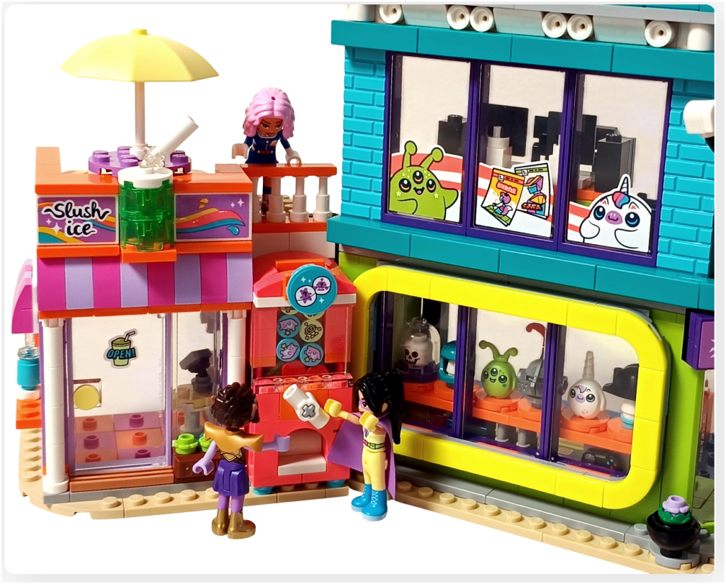 レゴ フレンズ 42674「コミックショップとゲームセンター」完成シーン フローズンドリンク店前のガチャマシンとリアン、アリヤ、ノヴァ