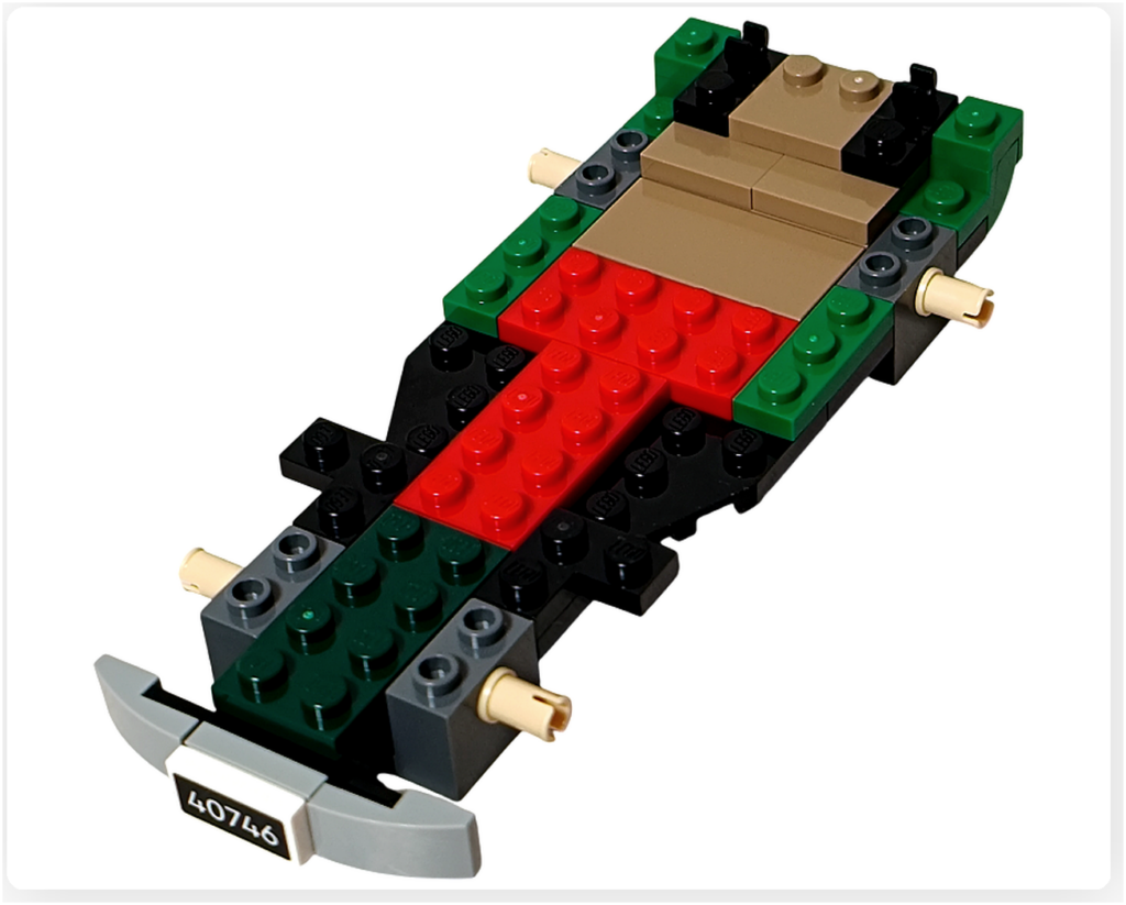 レゴ 40746 シーズナル クリスマスプレゼント配達トラックの組立途中。車軸まわりと側面の緑のブロックが組み立てられ、外枠が見えてくる工程の写真です。
