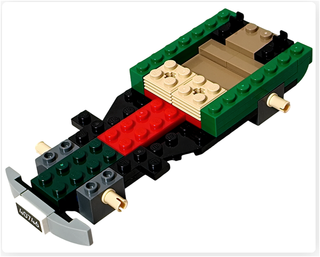 レゴ 40746 シーズナル クリスマスプレゼント配達トラックの組立途中。車軸まわりと側面の緑のブロックが組み立てられ、外枠が見えてくる工程の写真です。
