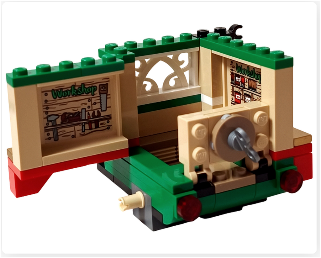 レゴ 40746 シーズナル クリスマスプレゼント配達トラックの左側面内側。開いたパネルからWorkshop棚のステッカーが見え、荷台内部の作りが分かる工程の写真です。