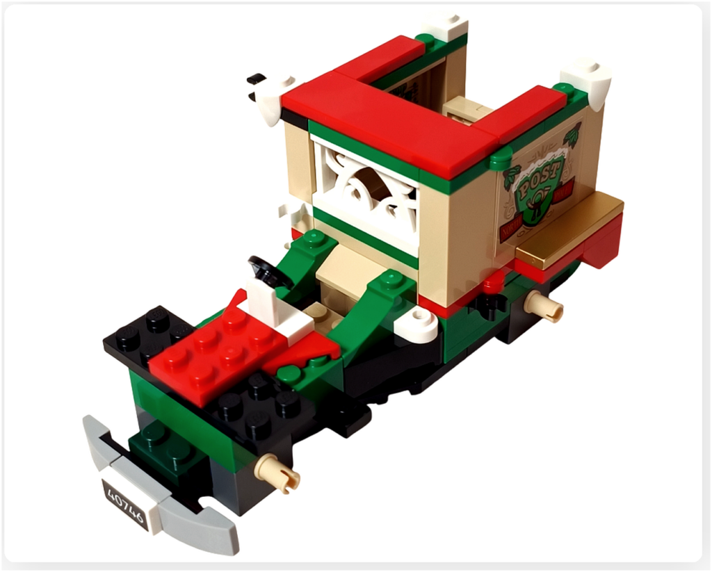 レゴ 40746 シーズナル クリスマスプレゼント配達トラックの組立シーン。フロント基礎と赤いボンネットの土台が組まれ、車両前部の形状が分かる工程写真です。