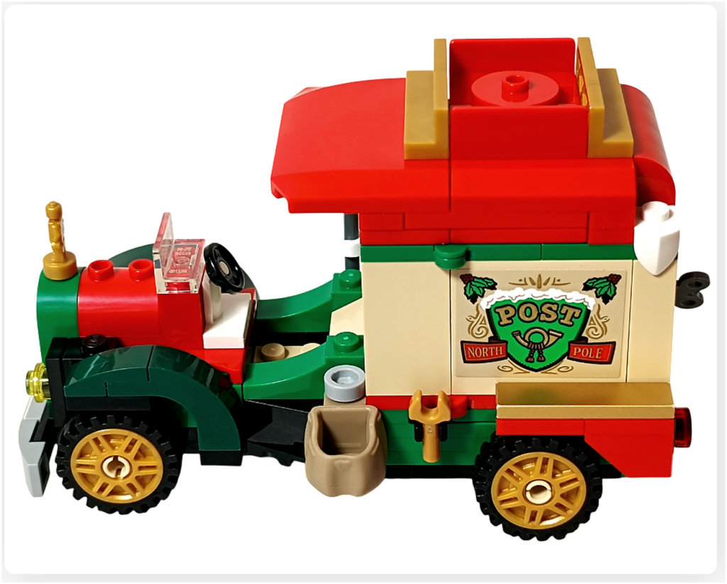 レゴ 40746 シーズナル クリスマスプレゼント配達トラックの完成外観。赤い屋根が取り付けられ、金色ホイールと緑の車体ラインがそろった状態を側面から写した写真です。