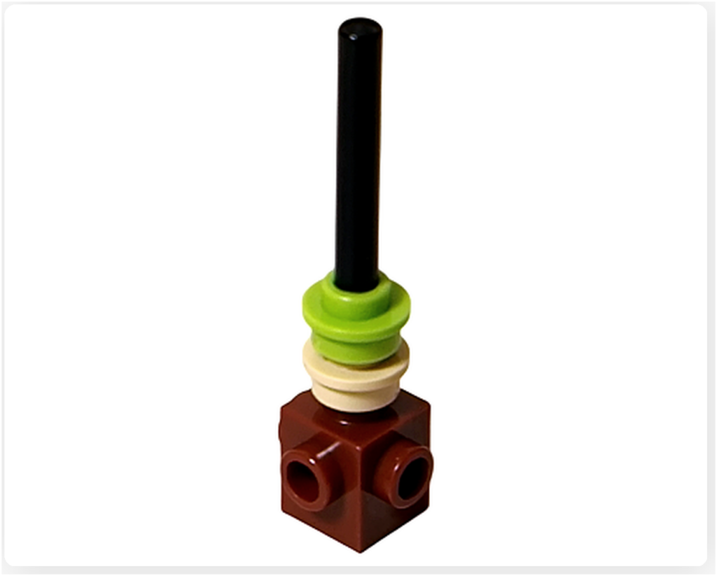 レゴ 40746 シーズナル クリスマスプレゼント配達トラックに含まれるクリスマスツリーの芯の作り始め。茶色のブロックに明るいアクセントパーツを重ね、幹の基礎を積み上げ始めた状態の写真です。