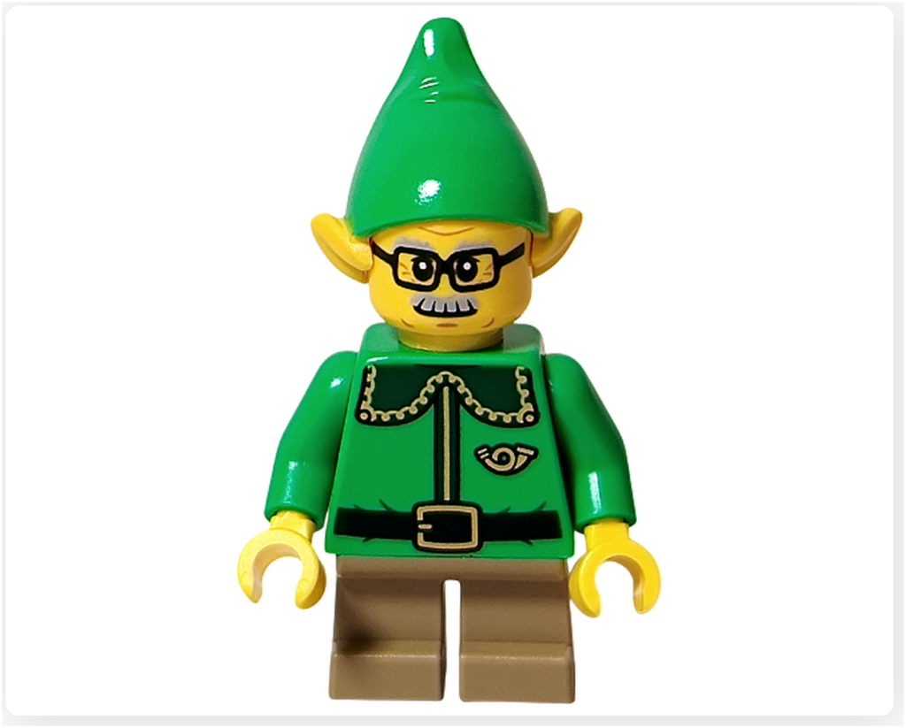 レゴ 40746 シーズナル クリスマスプレゼント配達トラックのエルフを正面から撮影した写真。緑色の帽子と制服、丸い眼鏡、黄色の耳が特徴で、冬の贈りものを運ぶ姿が分かりやすく写っています。