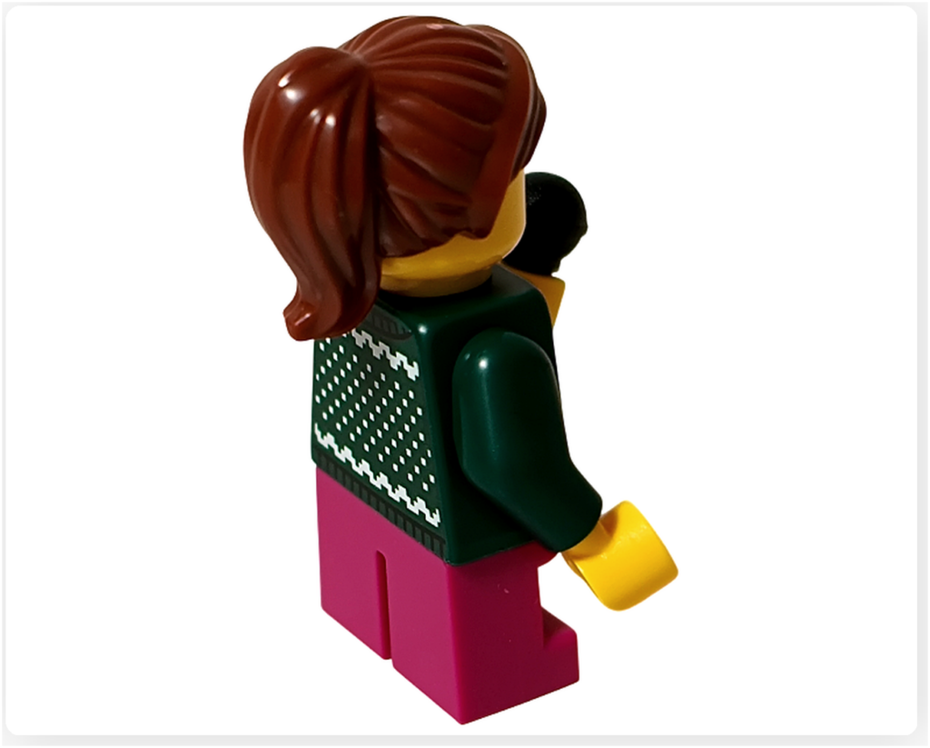レゴ 40778 雪のあずまや(Winter Gazebo)に含まれる歌い手ミニフィグ背面。ダークグリーンのセーター背面模様とポニーテールの髪型が見える。