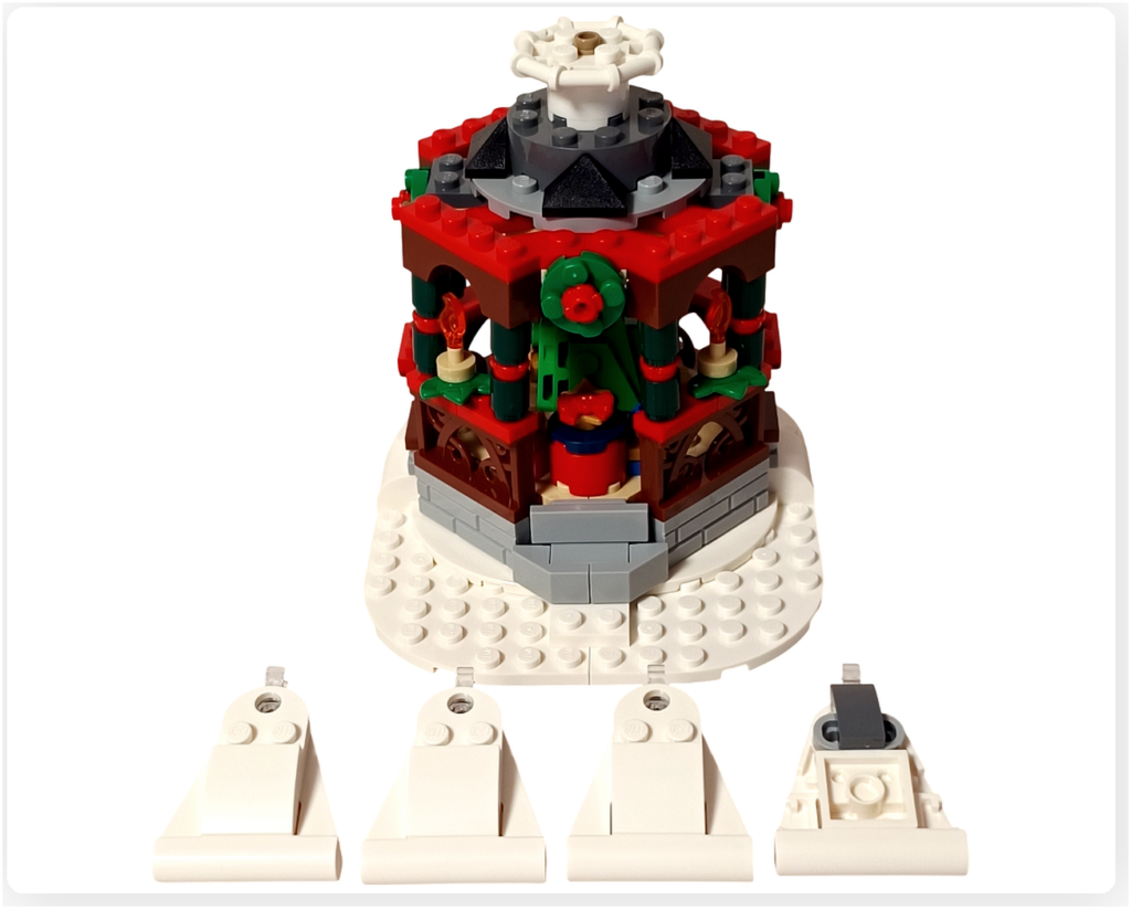 レゴ 40778 雪のあずまや(Winter Gazebo)モデルで、屋根パネル4枚(半分)を組み立てた工程。完成したあずま屋の前に、白い三角形状の屋根パーツが並べられている様子。