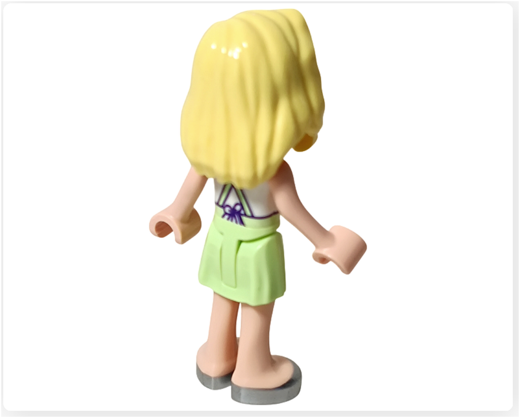 レゴ フレンズ 41733「タピオカティスタンド」のミニドール、マチルダの背面写真。エプロンのひもとリボンのプリントが見える後ろ姿。