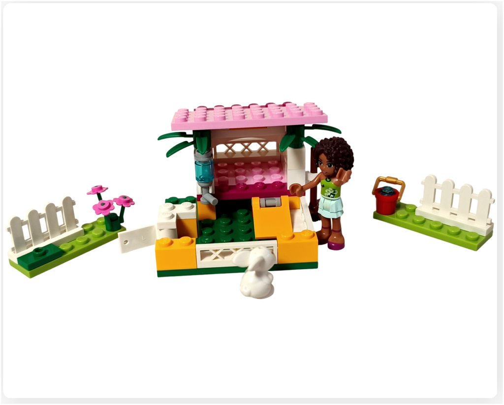 レゴ 3938 バニーガーデン 完成したうさぎ小屋を見学するジャズとアンドレア。開いた扉やスロープ、小屋の内部を確認する様子を再現した写真。