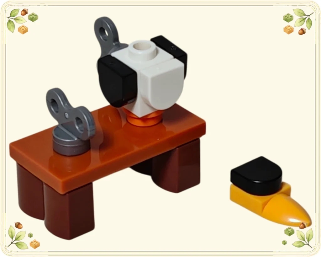 レゴ 60510 アドベントカレンダー2026 茶色の作業台に載せたペンギンの胴体と別に置いたくちばし付きの頭部